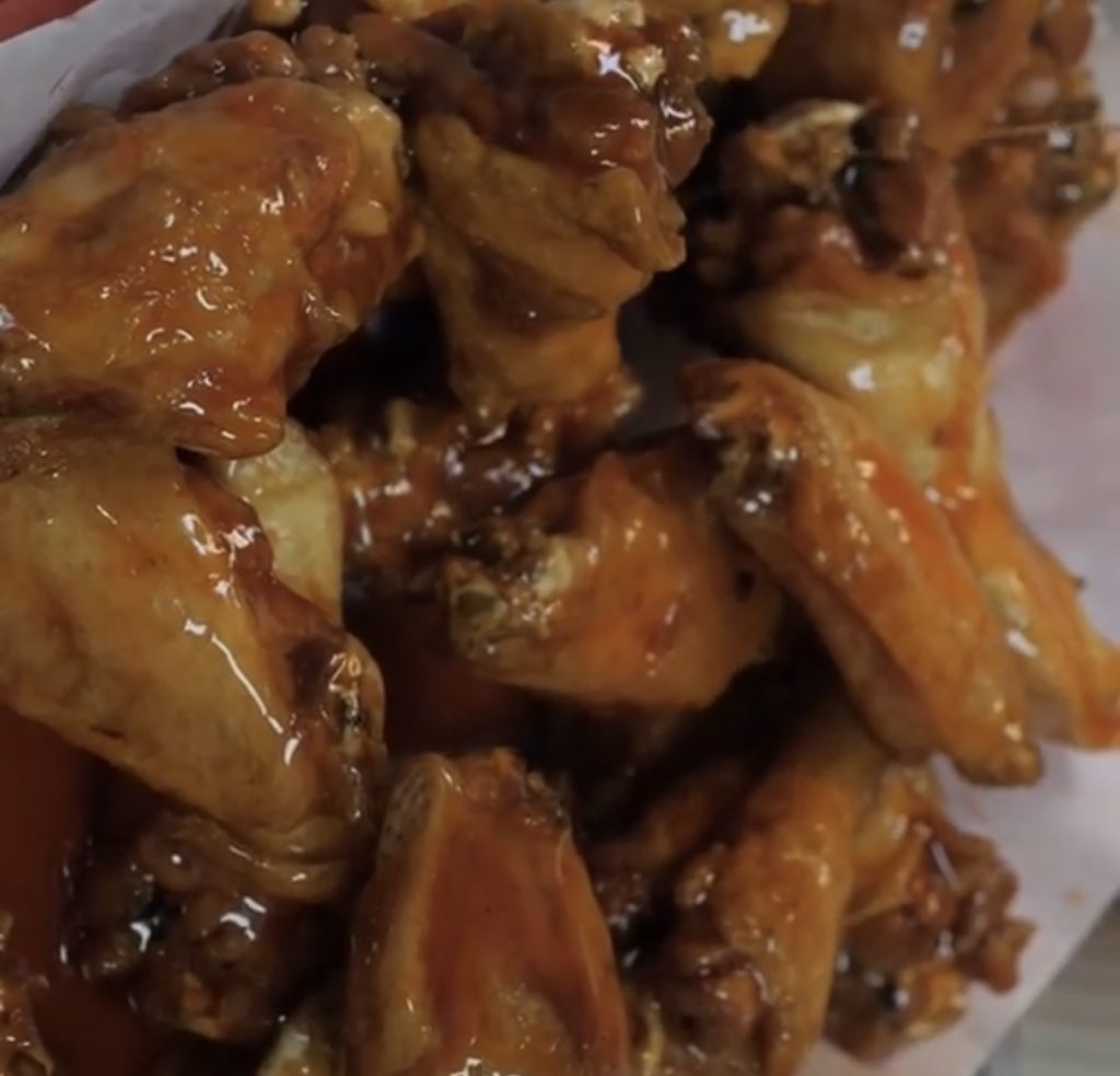 A plate of saucy 10 WINGS.