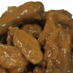 A pile of sauced chicken wings.