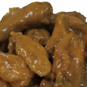 A pile of sauced chicken wings.