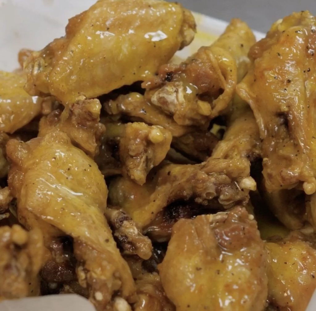 A close-up of 30 Wings Combo on a plate.