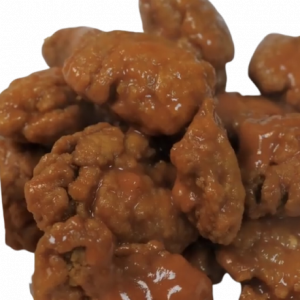 A pile of sauce-coated chicken wings.