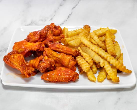 A plate of buffalo wings and crinkle-cut fries.