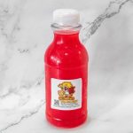A bottle of red liquid with a label, placed against a marble background.